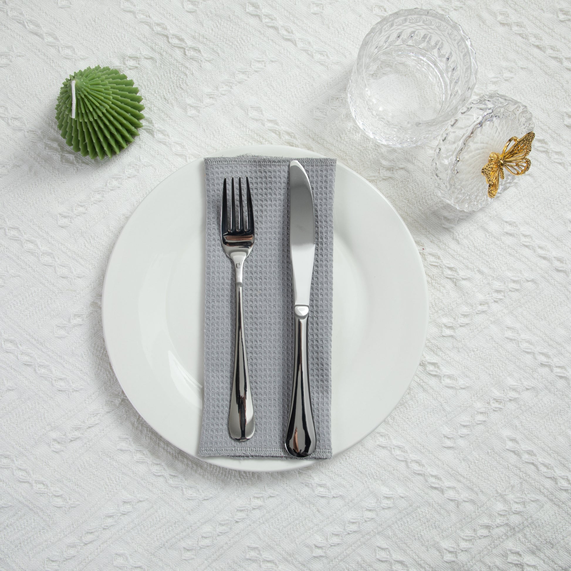 Modern kitchen table setting with cool grey waffle napkin