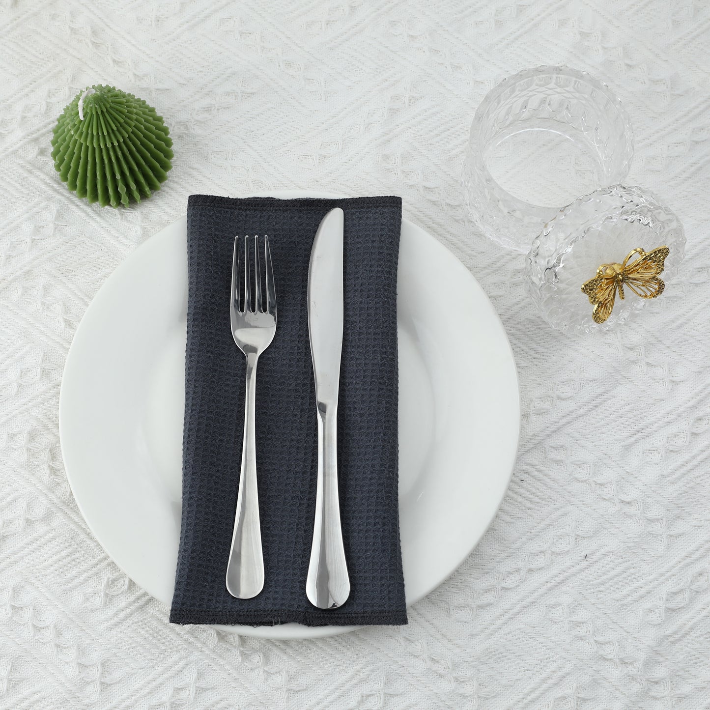 Elegant dinner setup with dark gray waffle weave napkin