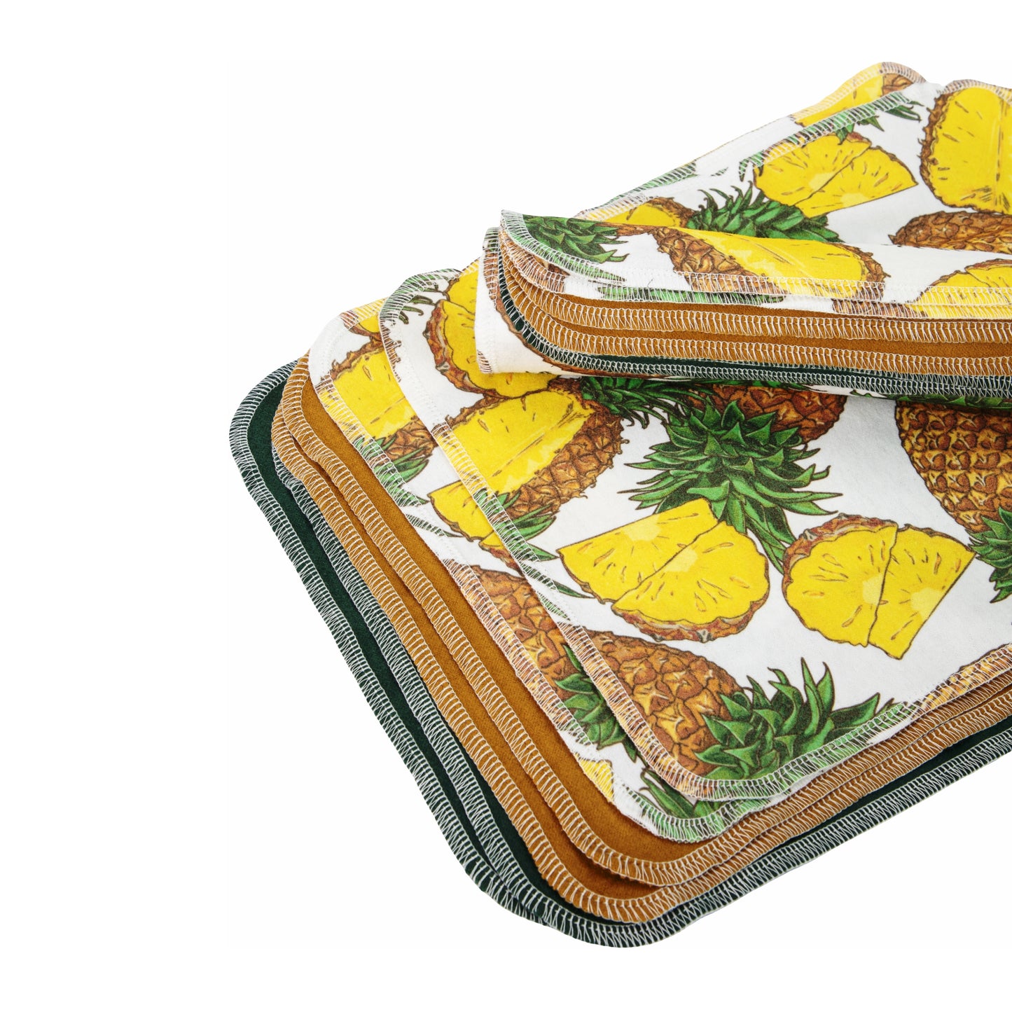 Tropical pineapple fruit print cloth napkins stacked summer hospitality decor